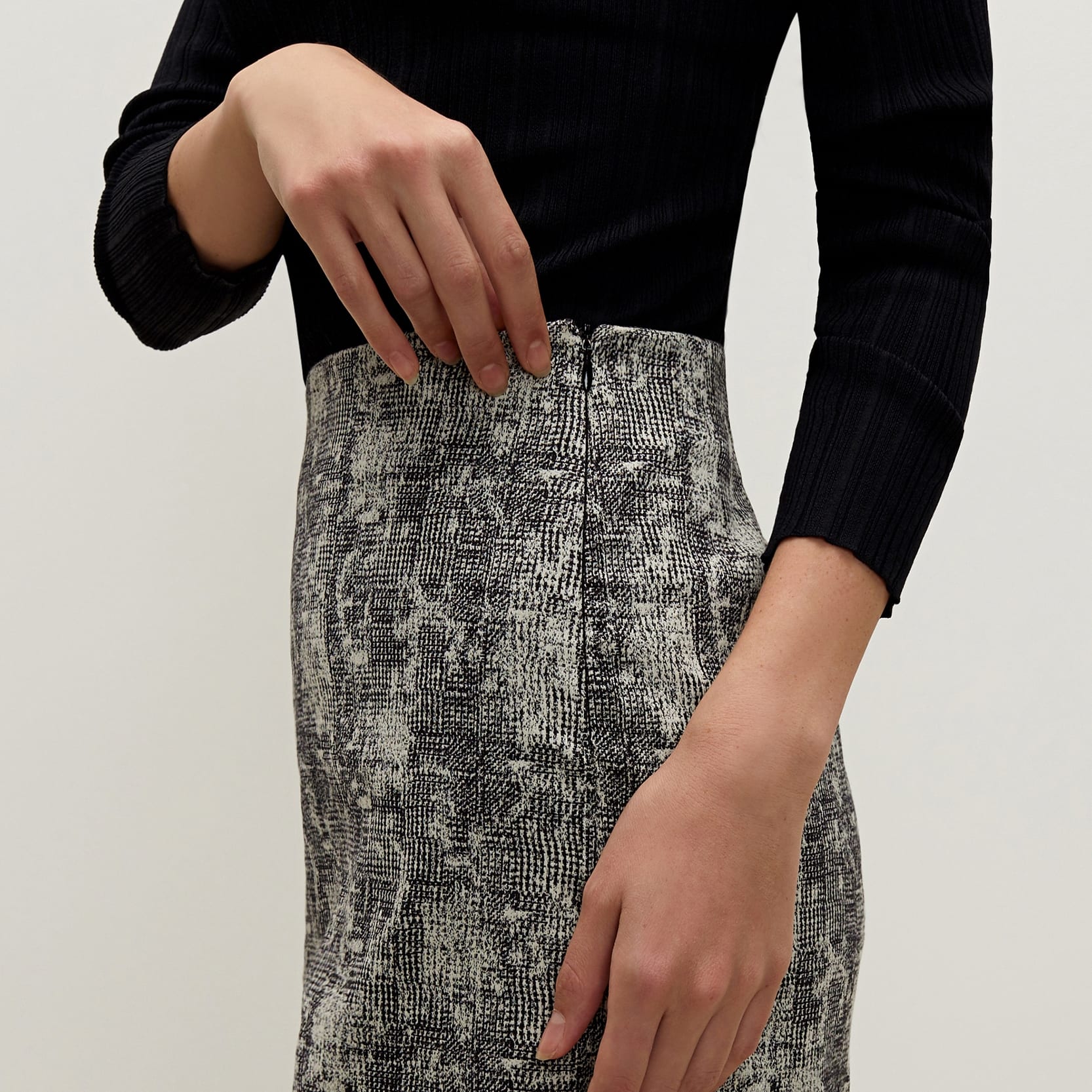 Side image of a woman standing wearing the Noho skirt in crackle | Exclude