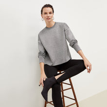 Front image of a woman standing wearing the Curie Pant--Worth in Black