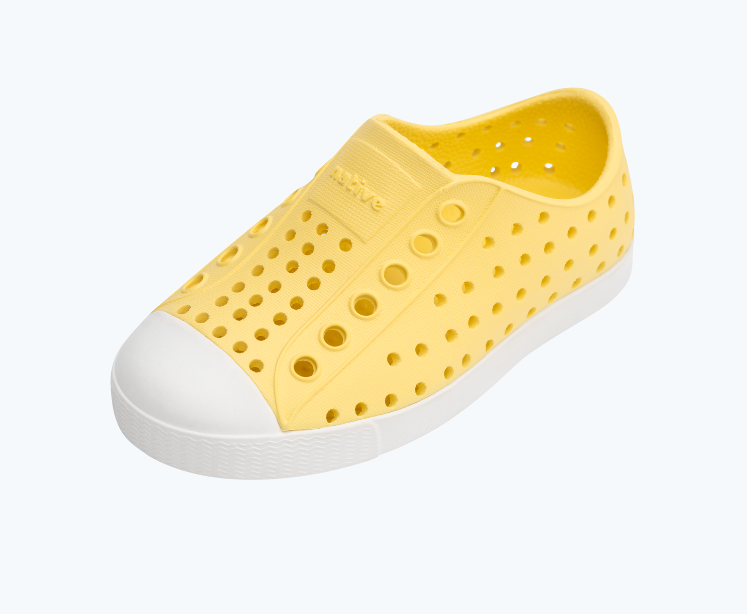 Angled view of a Native Shoes Kids Jefferson Kids | Gone Bananas Yellow/ Shell White Footwear