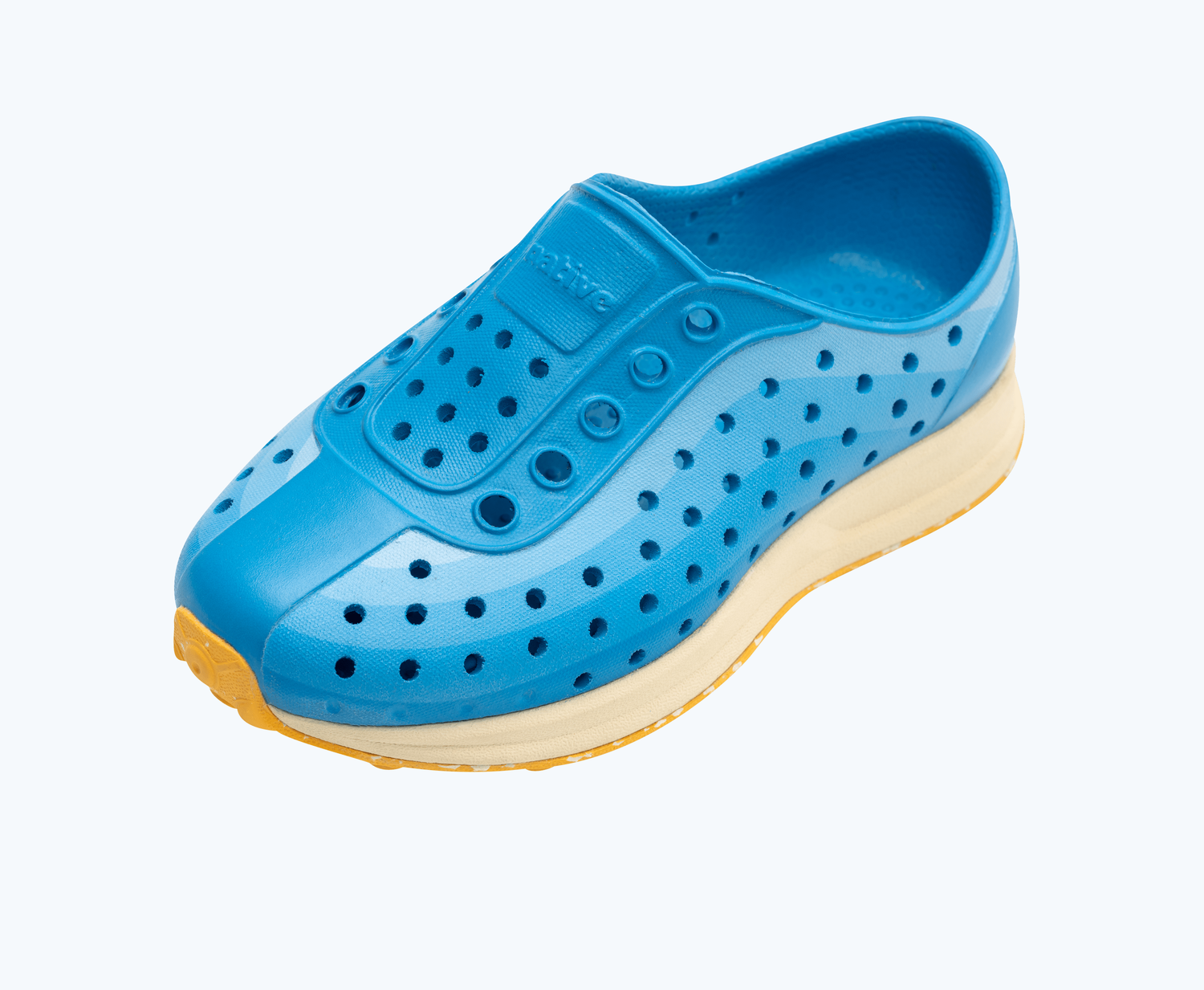 Angled view of a Native Shoes Kids Robbie Print Kids | Wave Blue/ Bone White/ Pineapple Speckle Rubber/ Wave Foggy Fade Footwear