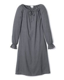 The Womens Flannel Delphine Nightgown in Grey by Petite Plume showcases a long-sleeve, off-shoulder design with a drawstring neckline. Made of soft flannel, its sleeves feature gathered ruffle cuffs for a loose, comfortable fit.