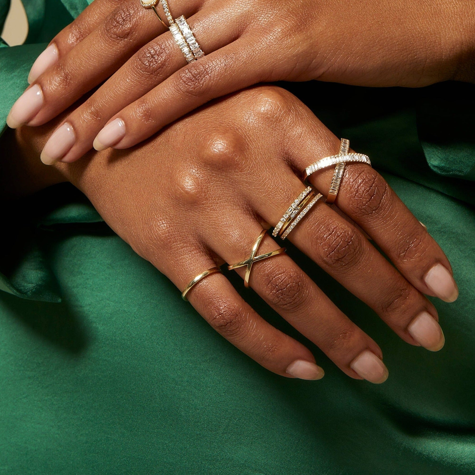 Lifestyle Model. Close up of hand with various gold and diamond rings