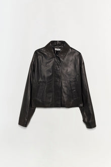 Black leather jacket with collared neckline, button front closure, and two front pockets displayed on neutral background.