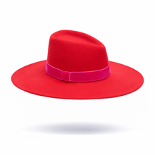 Red hat with a pink band on a white background