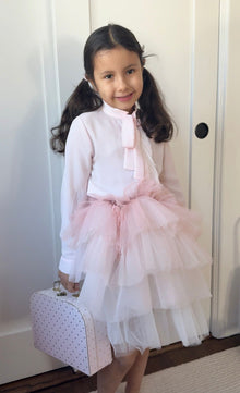 Blush pink girls outfit with bow blouse, matching skirt, feather purse, and pink beret