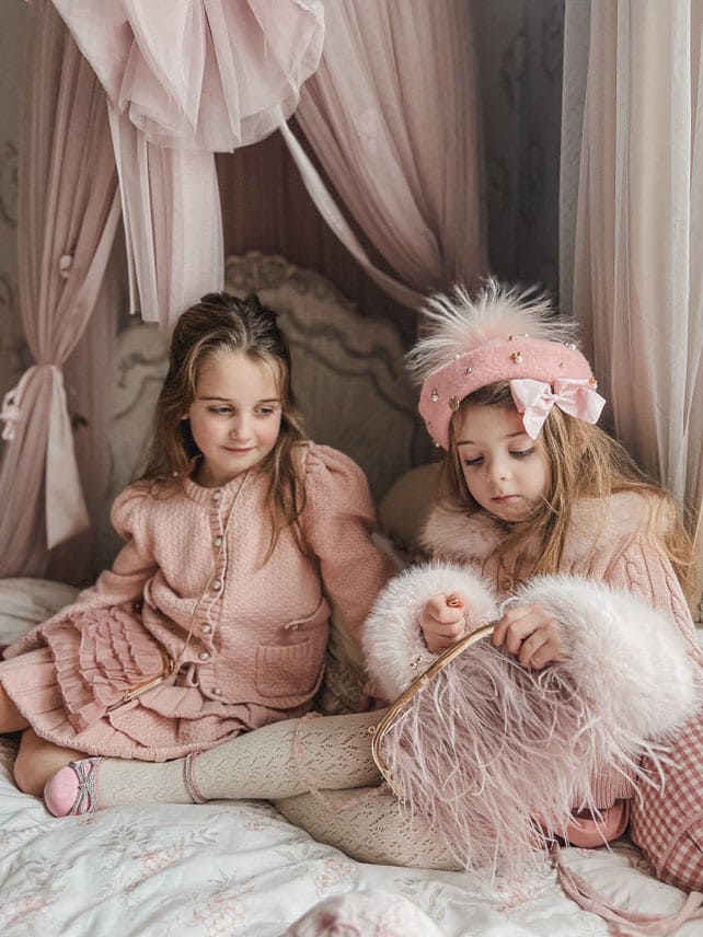 Julie pink cotton cardigan set styled with feather purse accessory, girls fashion detail