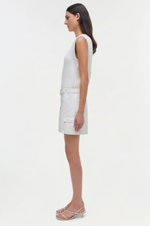 White sleeveless dress with ribbed bodice and cargo-style skirt with belt detail.