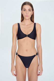 Black bikini top with V-neckline, thick shoulder straps, and center clasp detail.