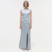 Light blue sleeveless floor-length gown with draped waist detail and side slit.