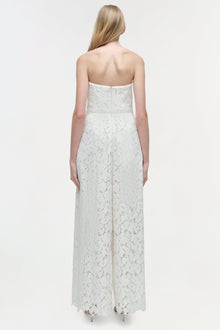 White lace strapless jumpsuit with straight neckline and wide-leg pants, shown from back view.