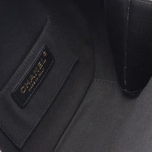 Chanel | Pre-Owned Quilted Lambskin Oval Logo Chain Top Handle Round Clutch on Chain | Black