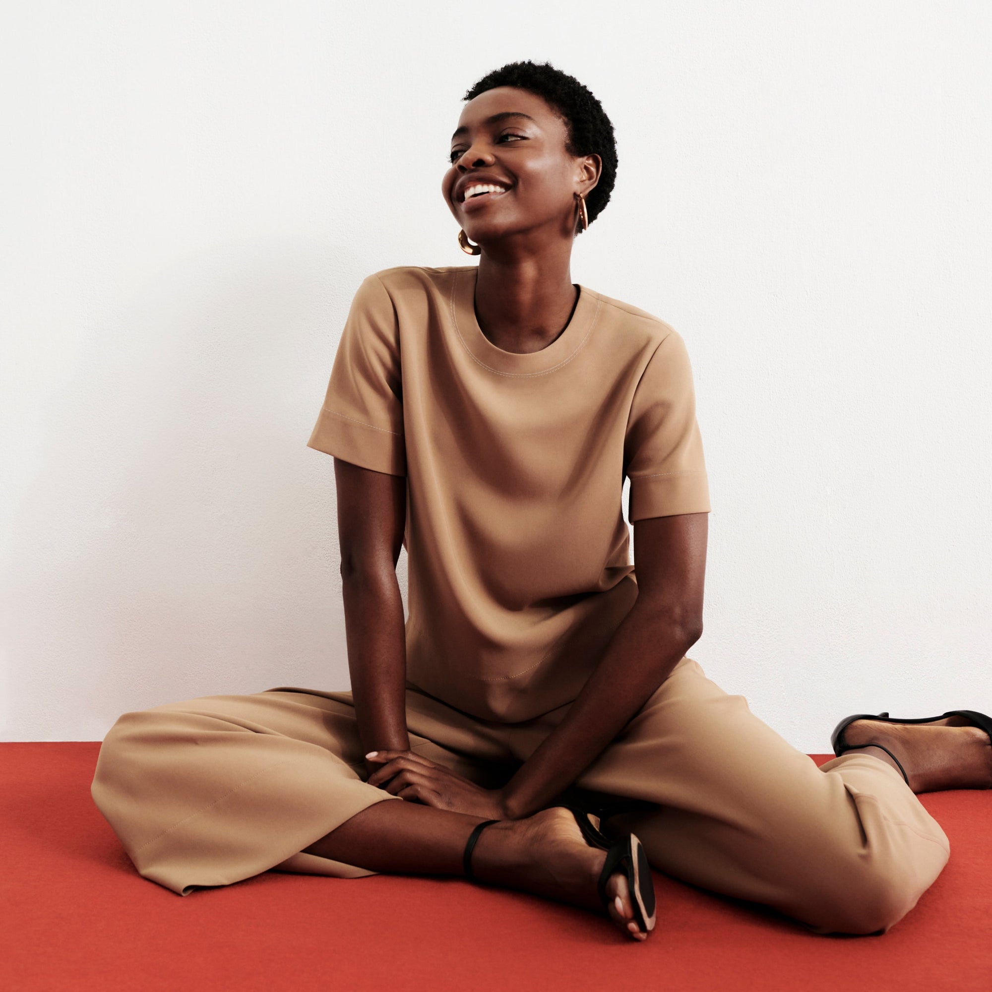 front image of a woman wearing the annika top in saddle