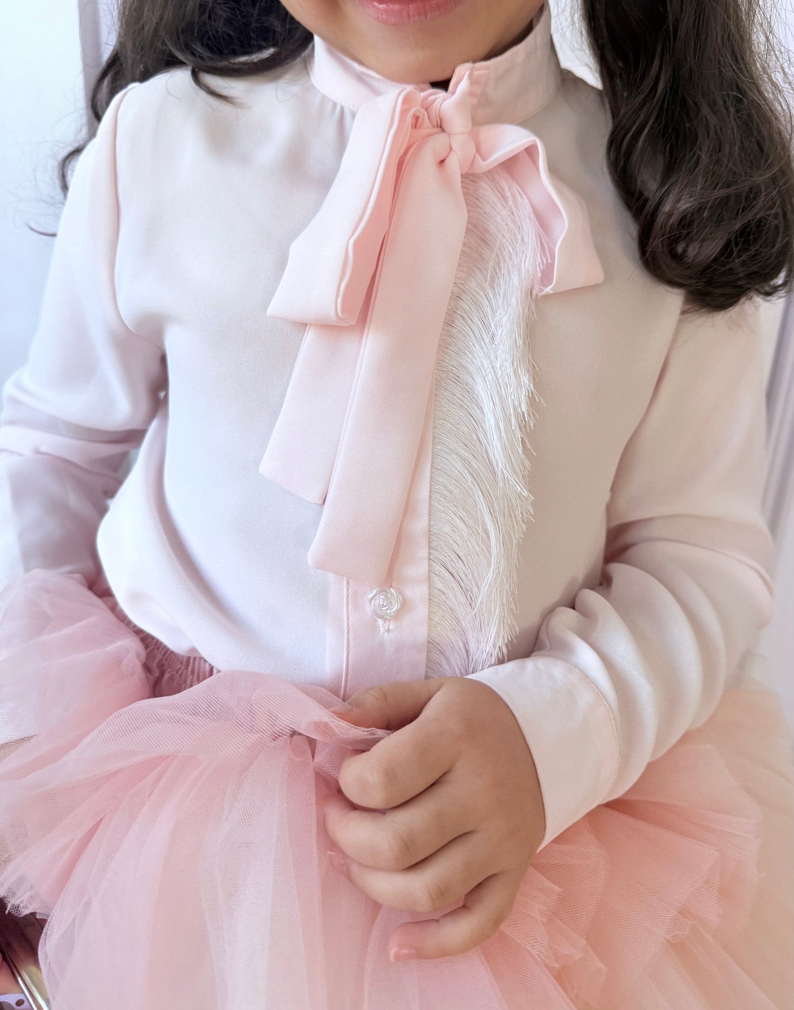 Close up of blush pink tie top with matching tulle skirt