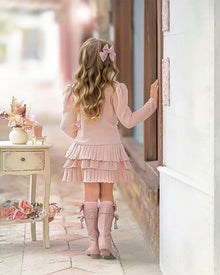 Back view of Julie pink knit cotton top and ruffle skirt set on girl model