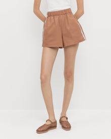 Cole Short in brown cotton, Rylee Pointelle Tank Top in white cotton, and Rita Brown Netted Mary Jane.
