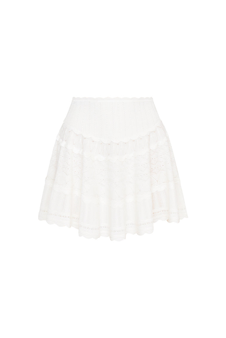 Knitted mini skirt featuring a ribbed yoke, elasticated waistband and a flouncy skirt.