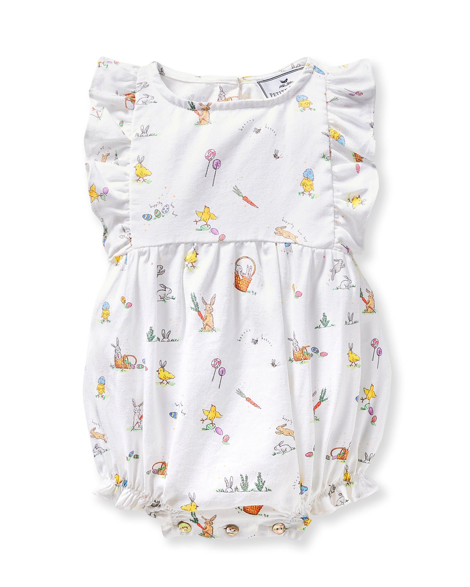 A young child with brown hair in pigtails wears the Baby's Twill Ruffled Romper in Easter Frolic, featuring colorful animal and floral prints, standing against a plain light background.