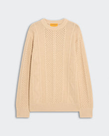Allday Cable Crew - Sandstone, a light beige cable-knit sweater featuring intricate textured patterns, ribbed cuffs, collar, and hem, laid flat on a soft gray background.