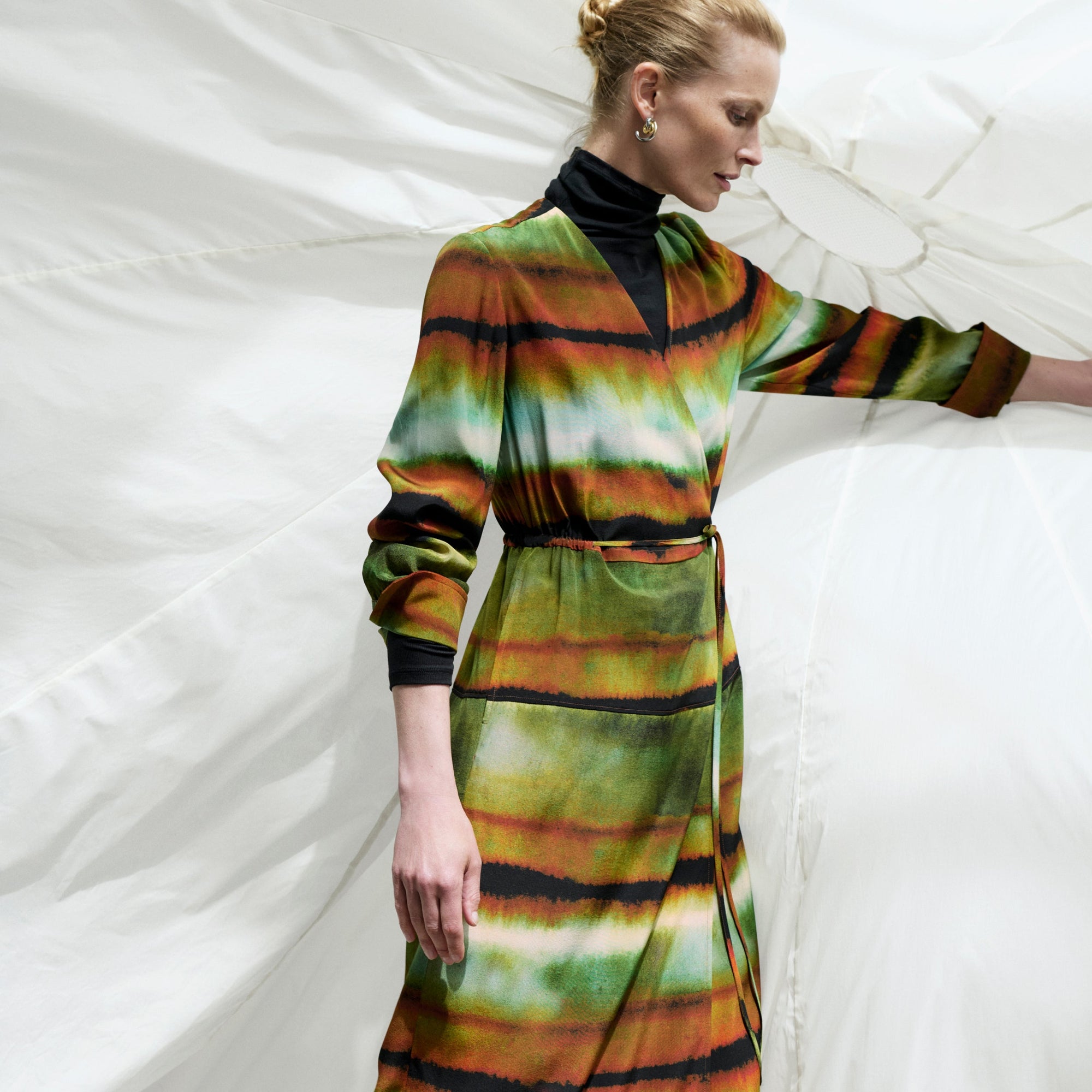 Front image of a woman wearing the Deana dress in Faded Print | Exclude