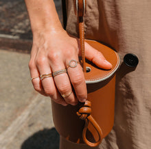 Quadricolor Ring with White Diamonds On Model Lifestyle. A close-up lifestyle shot of a woman various stacked rings.
