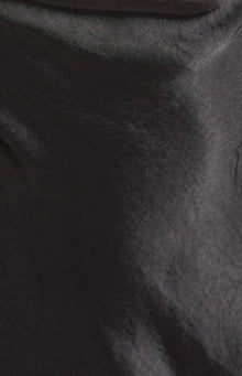 Close-up of the black mini dress fabric, showing its subtle sheen and crinkled texture