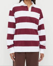 Evan Rugby Shirt in maroon and white striped cotton and Venus Track Pant in brown cotton.