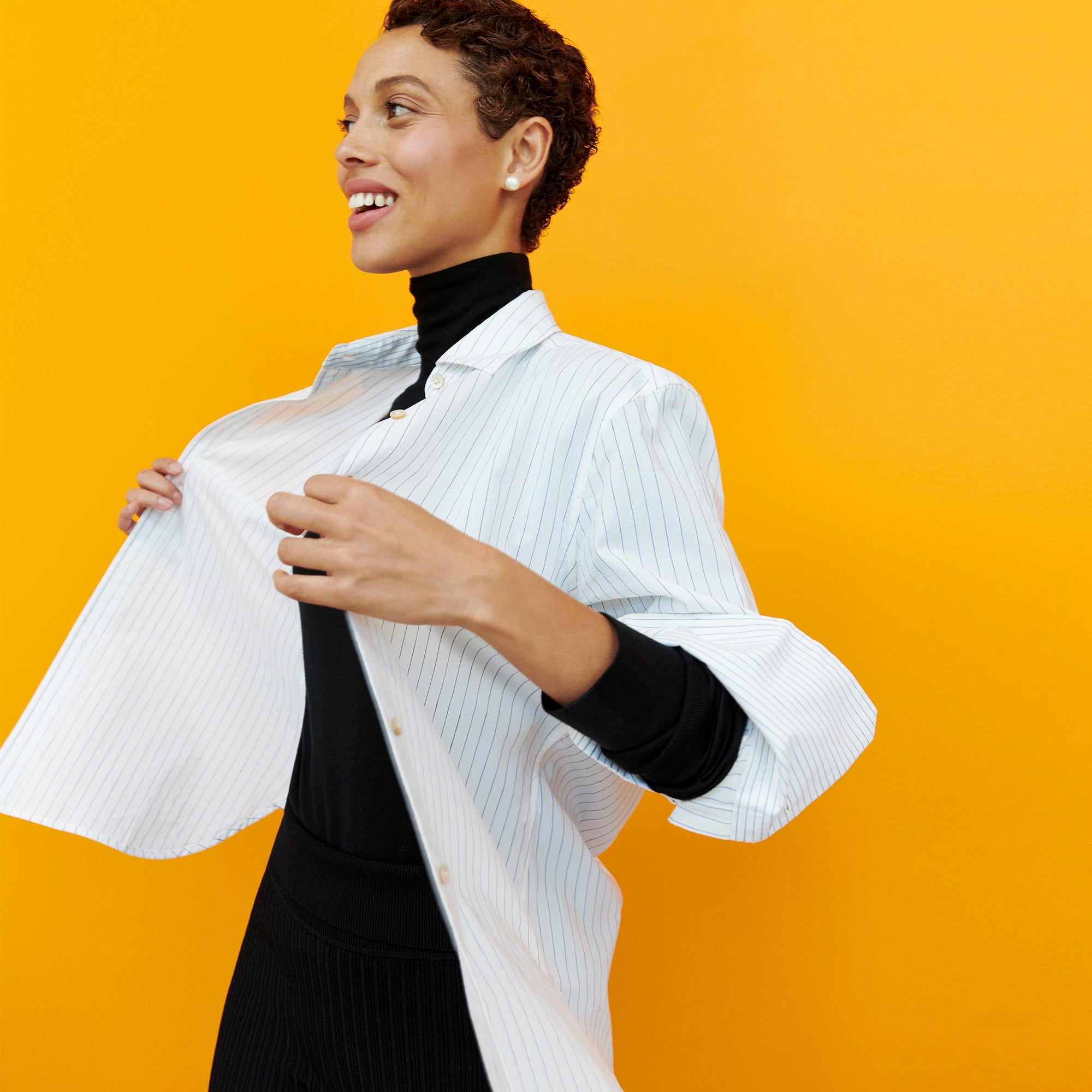 Front image of a woman wearing the Mila Button Down - Poplin Stripe in Blue / Ivory | Exclude