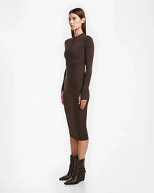 A woman in the AGNES - 8524551 Espresso zip-up dress by Rudsak.