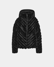 The Rudsak ANASTASIA - 8124804 Black jacket features black faux fur with a chevron pattern, front zipper, and hood, offering cozy velvet puffer comfort, shown on a plain light gray background.