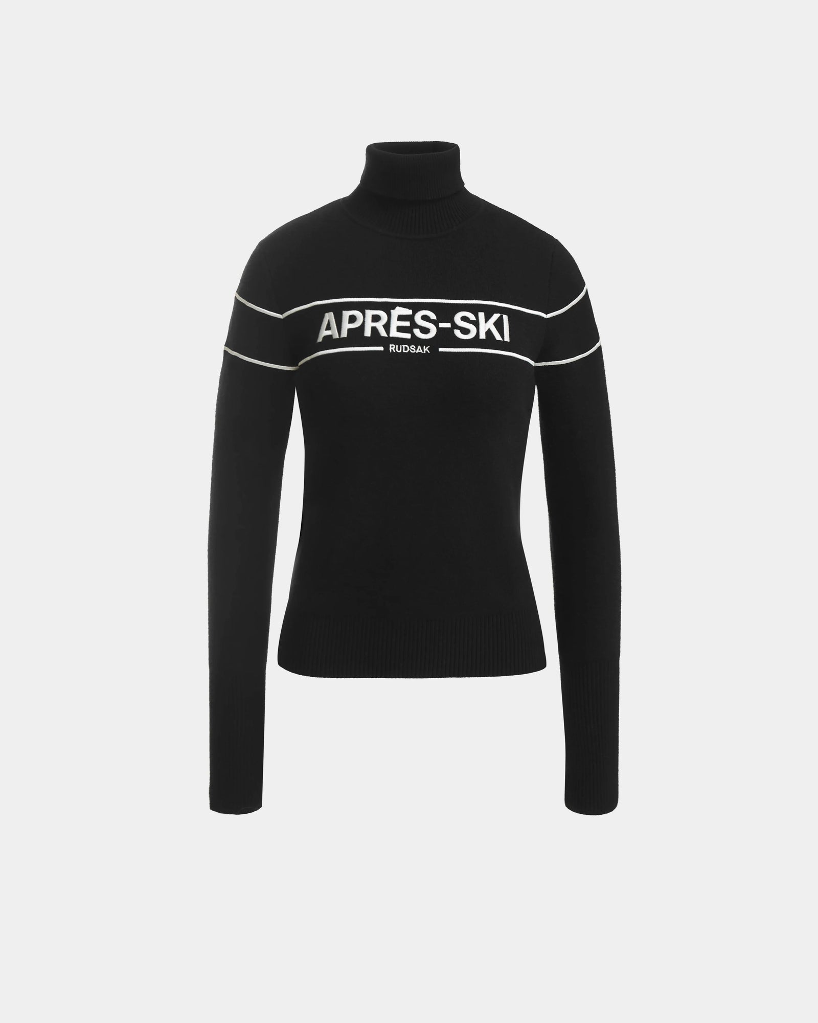 The ERIKA - 8523536 Black by Rudsak is a black turtleneck sweater with long sleeves, white horizontal stripes, and bold APRÈS-SKI RUDSAK lettering—a cozy après-ski piece perfect for your winter wardrobe.