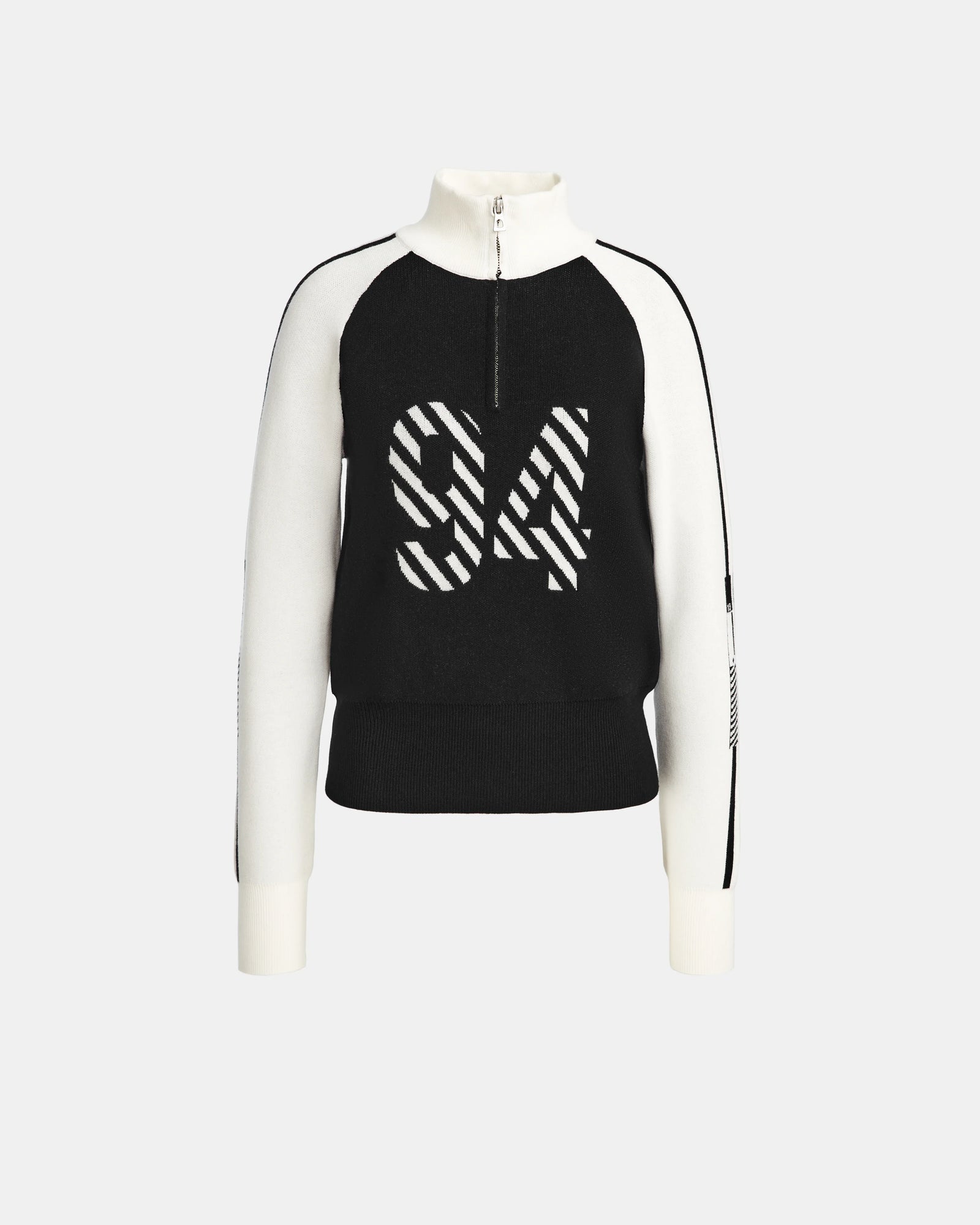 The FANNY - 8524506 Black by Rudsak is a women’s black and white knit pullover sweater featuring a front zip collar and bold 94 in striped text, with white sleeves and collar accented in black—ideal for winter layering.