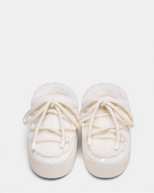 A pair of HARRIET - 8224519 Iceland baby shoes by Rudsak, soft and white with fluffy lining and white laces, resembling mini moon boots, are placed side by side on a plain light background.