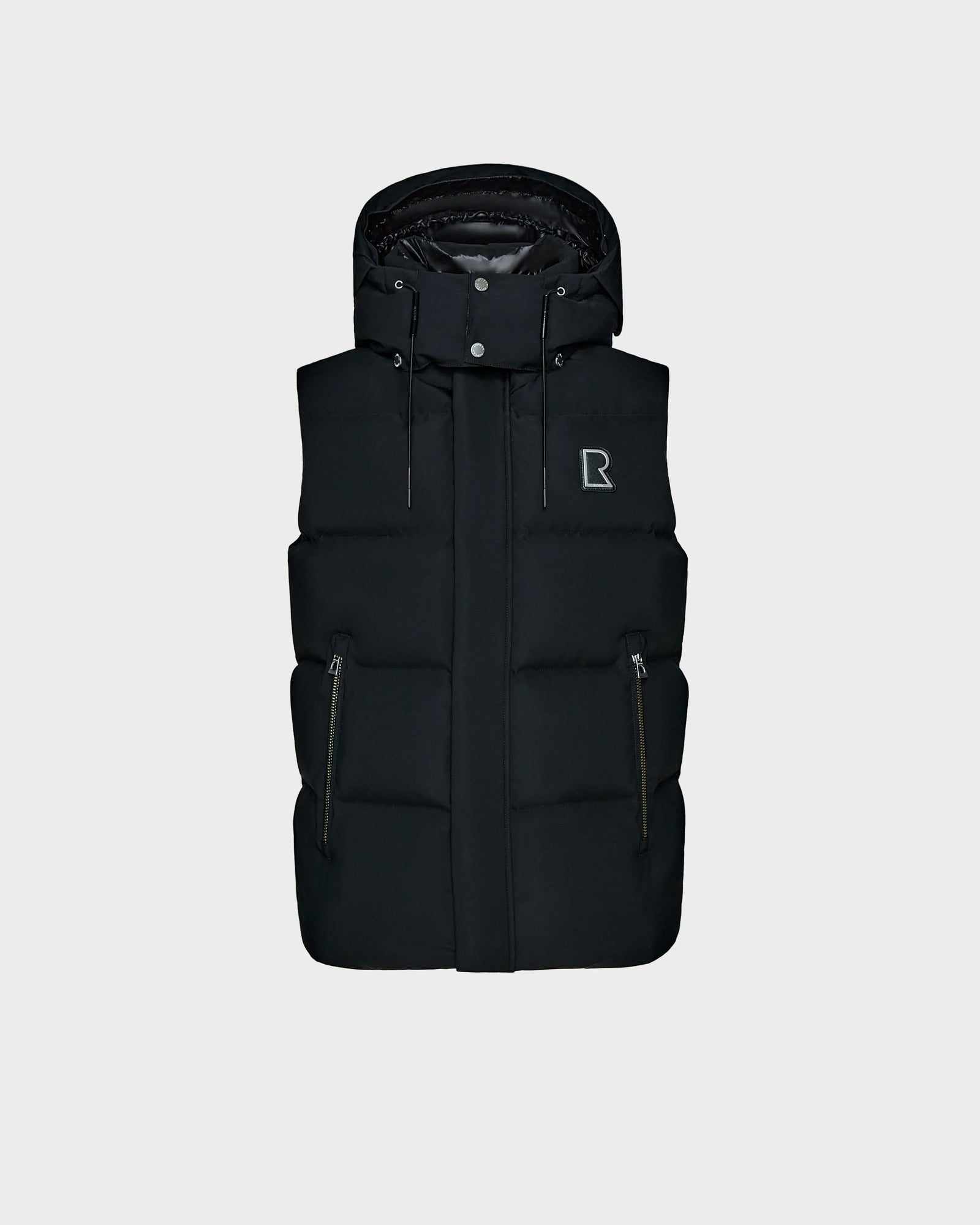 The Rudsak REN M - 9123512 Black padded puffer vest features RDS-certified down, zippered side pockets, and a small R logo on the left chest, shown against a plain light gray background.