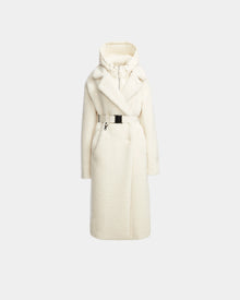 The Rudsak TINA - 8123578 Iceland is a long white women’s teddy coat with a large collar, removable hooded bib, and button details, shown on a plain light gray background.