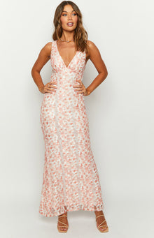 Peach floral lace maxi dress with a deep V-neckline and fitted silhouette