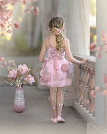 Back view of blush pink girls velvet dress with lace up back and satin bow