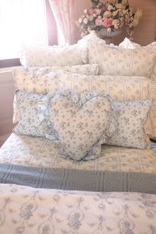 This dreamy ensemble features a delicate blue floral pattern on a pristine white backdrop. Crafted from 100% cotton
