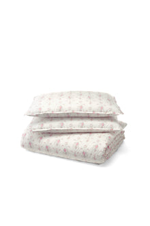 This dreamy ensemble features a delicate pink floral pattern on a pristine white backdrop. Crafted from 100% cotton