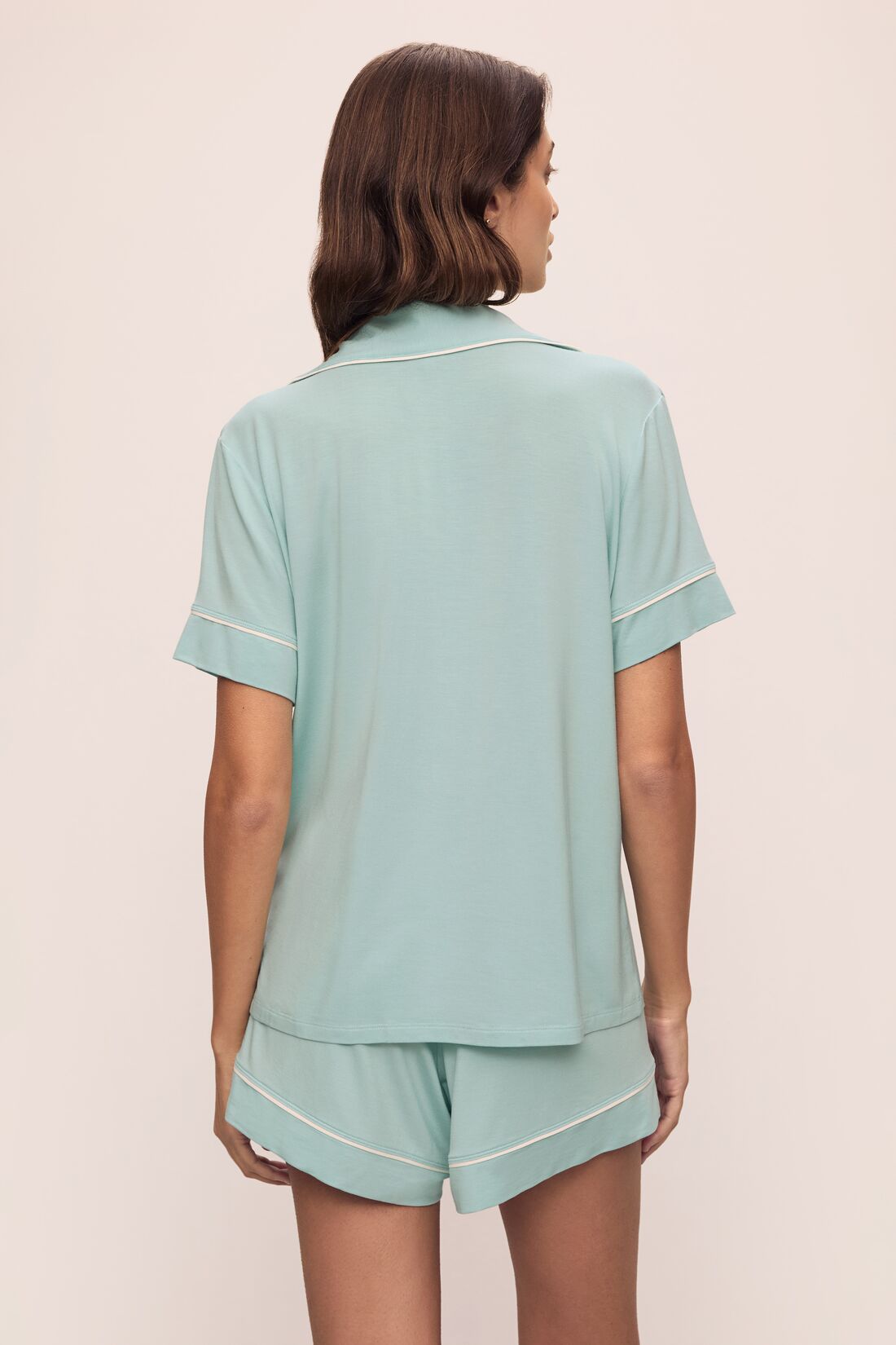 Model is wearing Gisele TENCEL Modal Relaxed Short PJ Set in Canal Blue/Ivory