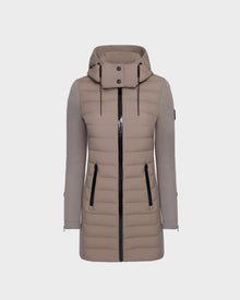 The Rudsak MERINA M - 8124030 Cement is a light brown, knee-length women’s quilted down jacket with a hood, black zippered front and side pockets, long sleeves with smooth texture, and horizontal quilting on the body.