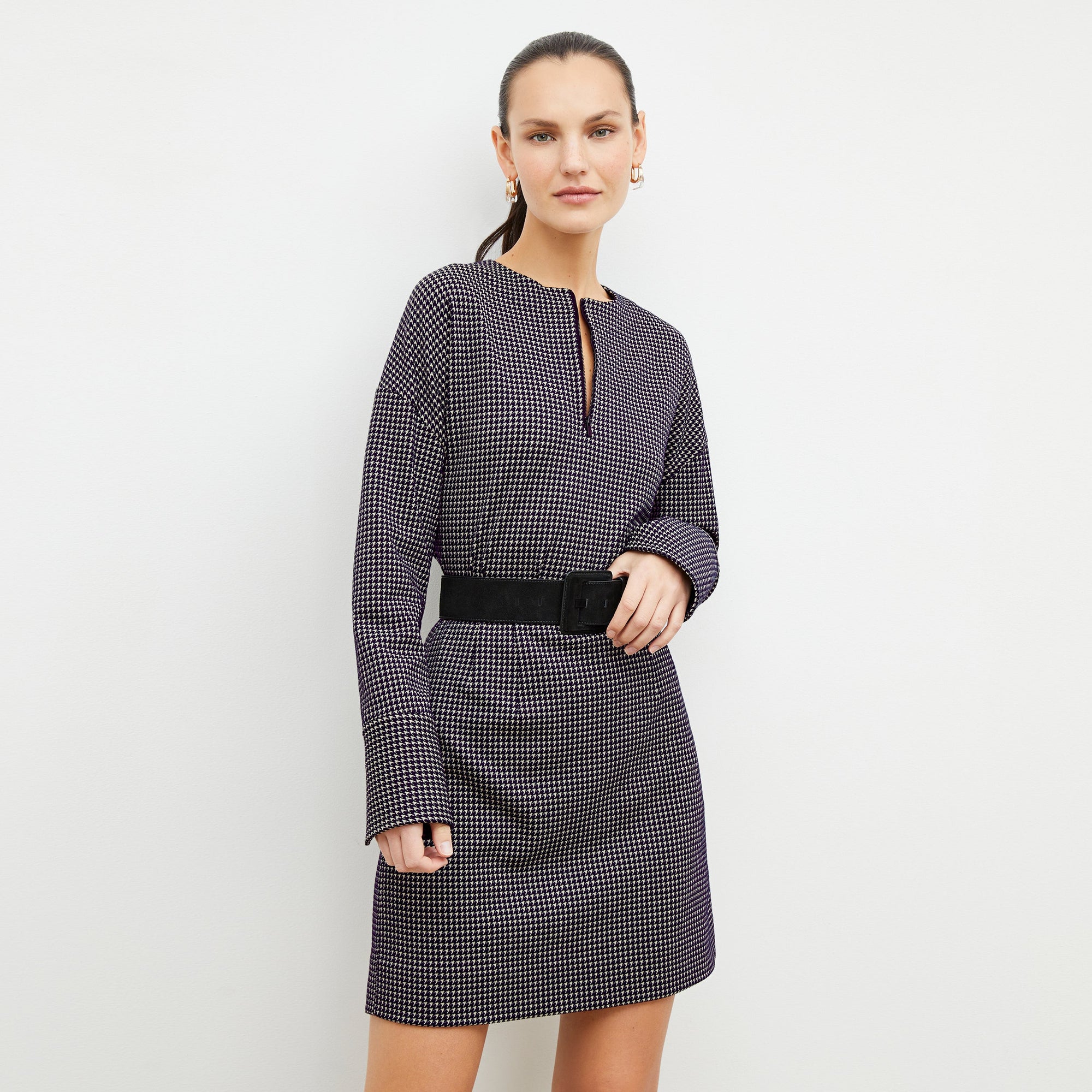 Front image of a woman wearing the whitney skirt in black and white