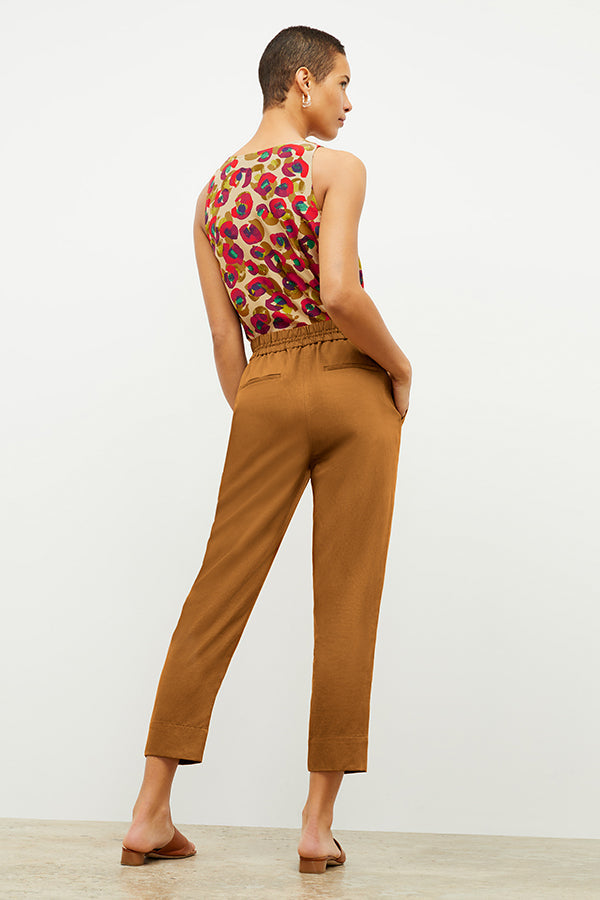 Back image of a woman wearing the Shane Pant in Acorn | Exclude | Grid Hover