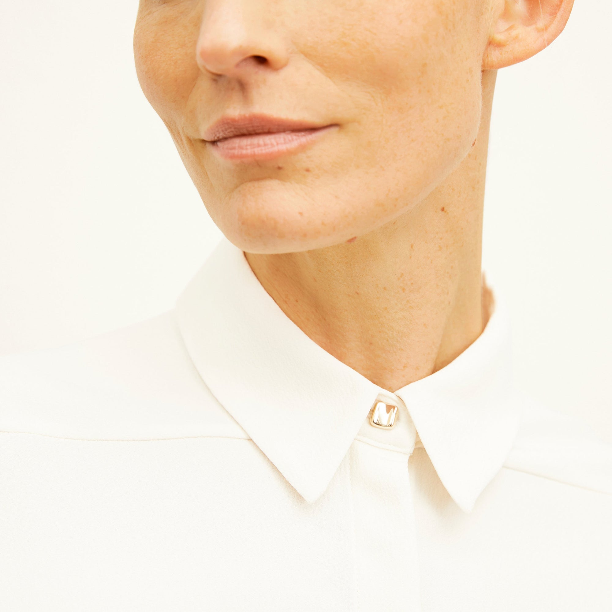 Front image of a woman standing wearing the Lagarde Shirt—Soft Wave in Alabaster