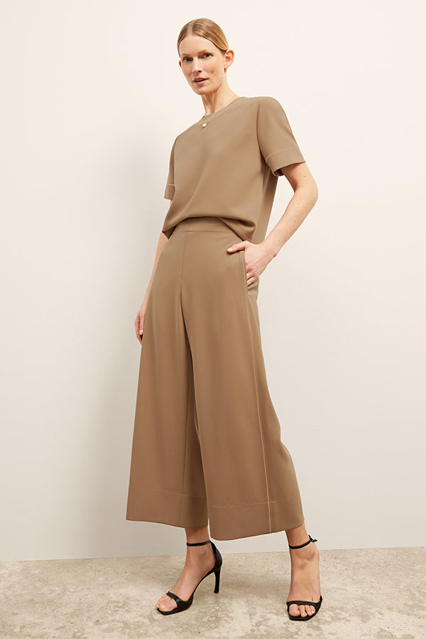front image of a woman wearing the annika top in saddle | Exclude | Grid Hover