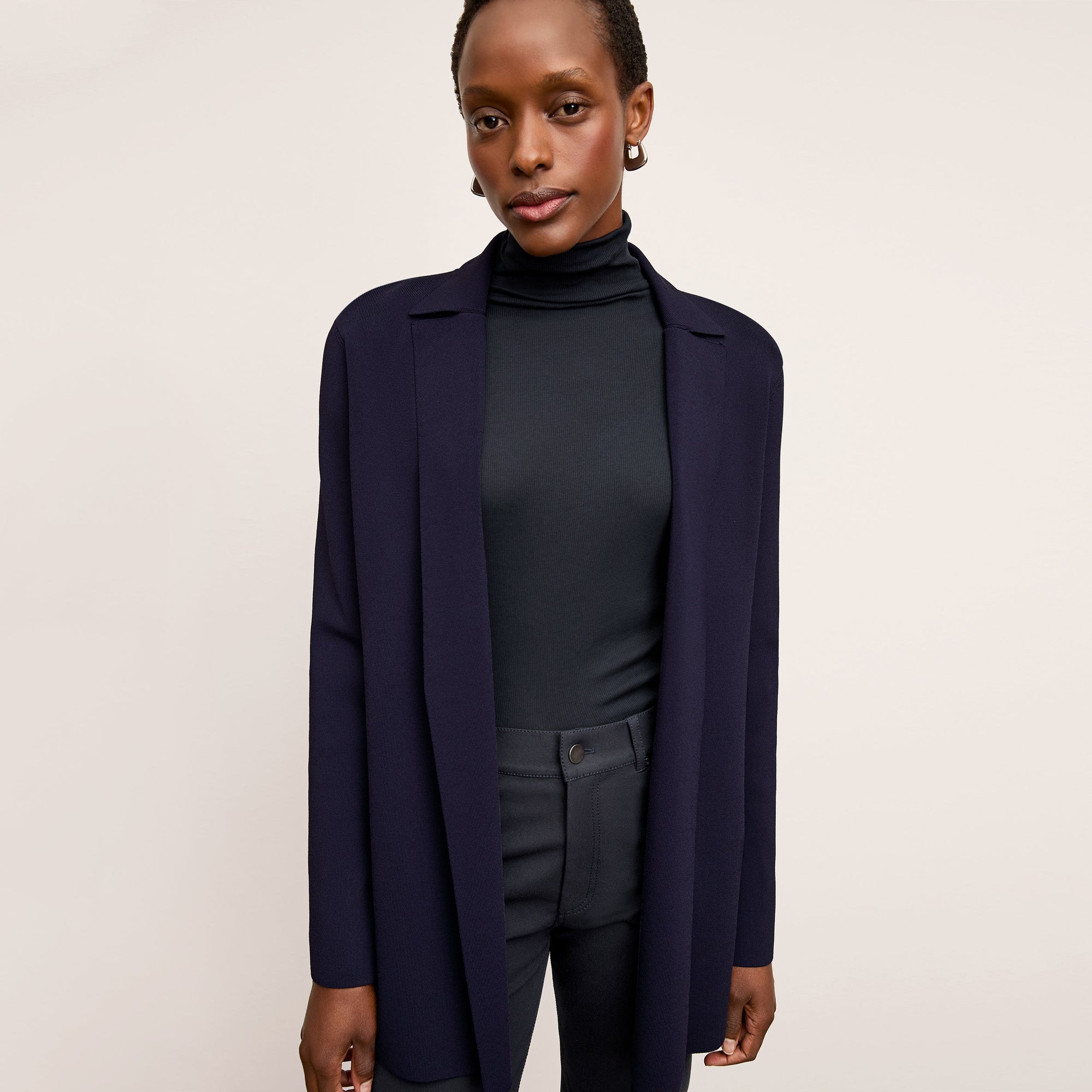 Front image of a woman wearing the Merritt Jardigan in Navy | Lead