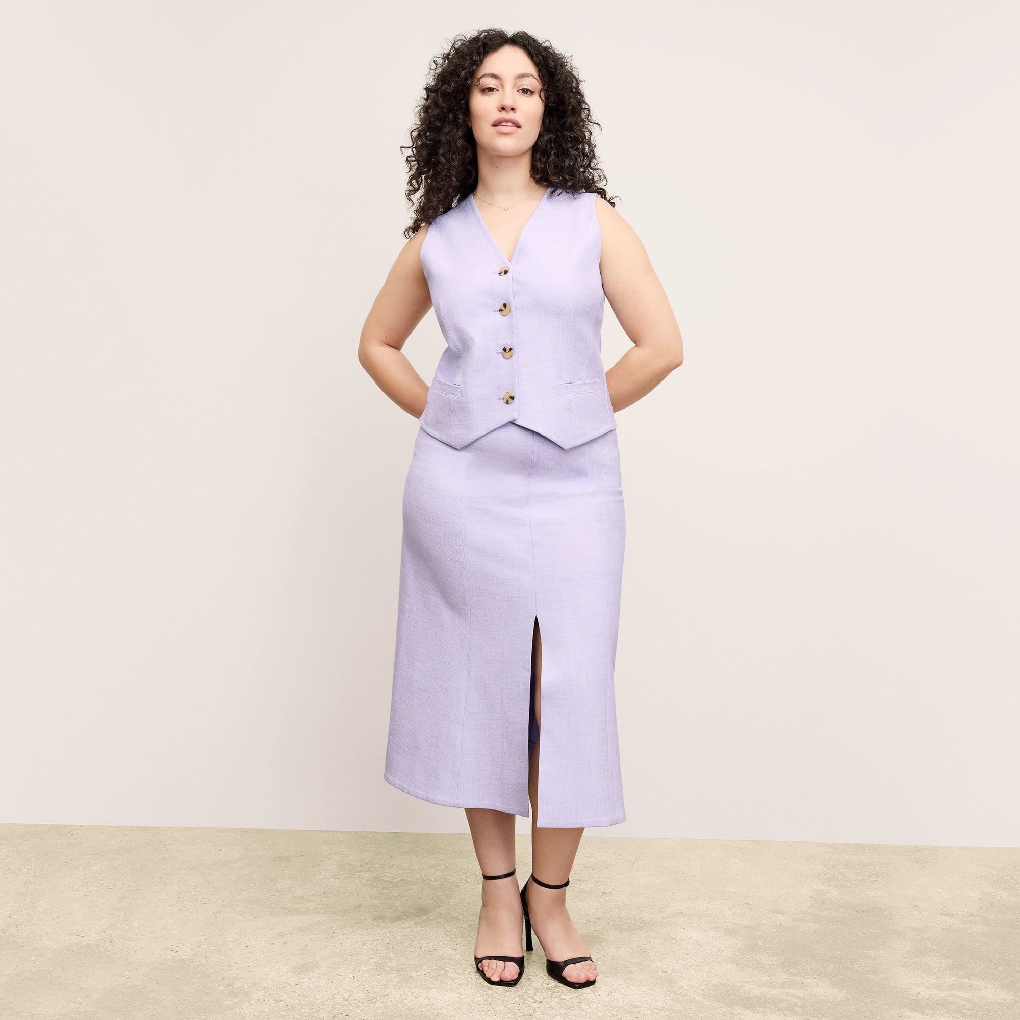 front image of a woman wearing the eva skirt in lilac/ivory 
