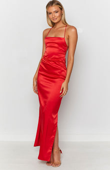 Cherry red satin maxi slip dress with a square neckline, thin straps, side ruching and a high leg slit