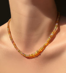 Mercury in Retrograde Faceted Opal Necklace hanging on the neck.