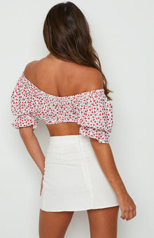 White textured mini skirt with a visible back zipper closure and straight fit