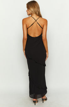Close-up of the black chiffon maxi dress with a V-neckline, keyhole cutout with tie detail, and diagonal ruffle